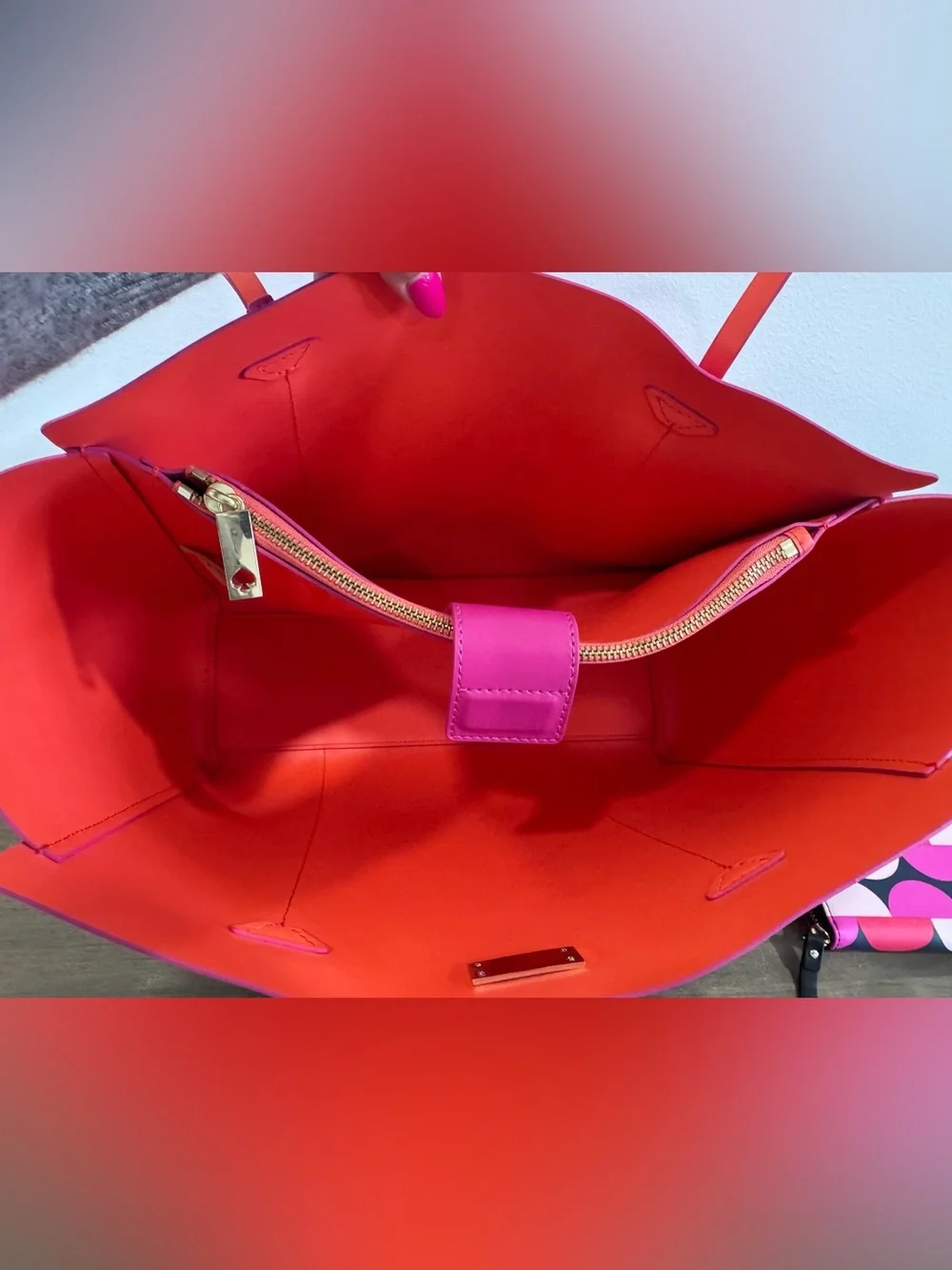 kate spade fuchsia tote with contrasting orange trim and patterned wallet